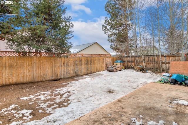 view of yard layered in snow