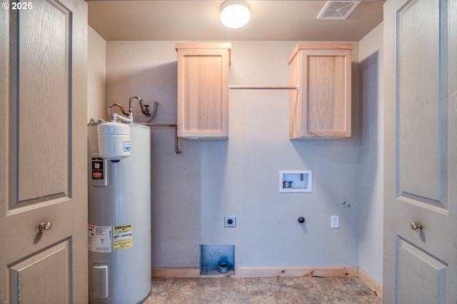 washroom featuring cabinets, washer hookup, hookup for an electric dryer, and water heater