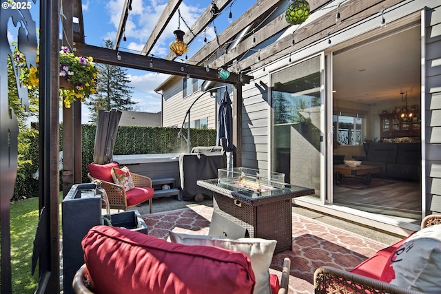 view of patio / terrace featuring fence, a pergola, and an outdoor fire pit