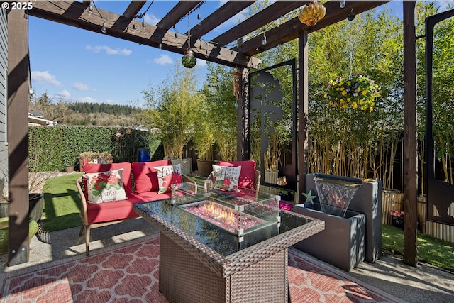 view of patio / terrace with an outdoor living space with a fire pit, fence, and a pergola