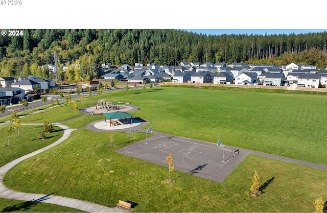 bird's eye view with a forest view and a residential view