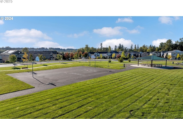 view of community with a lawn and a residential view