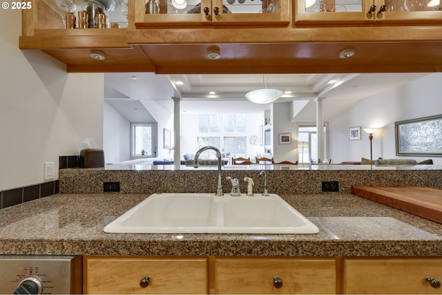 844 SW Broadway Dr Unit 3, Portland, OR 97201 - kitchen featuring a sink, tile countertops, open floor plan, washer / clothes dryer, and recessed lighting