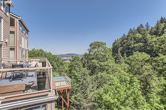 844 SW Broadway Dr Unit 3, Portland, OR 97201 - exterior space with outdoor dining area and a view of trees