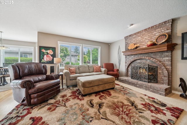 2678 SE Myrtlewood Way, Gresham, OR 97080 - living area with a fireplace and a textured ceiling