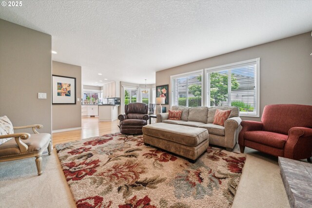 2678 SE Myrtlewood Way, Gresham, OR 97080 - living room with recessed lighting, a textured ceiling, and light wood finished floors