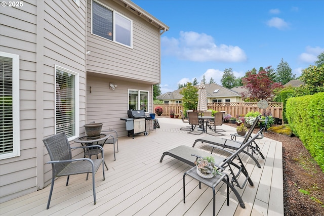 2678 SE Myrtlewood Way, Gresham, OR 97080 - wooden terrace featuring a fenced backyard, outdoor dining area, and area for grilling