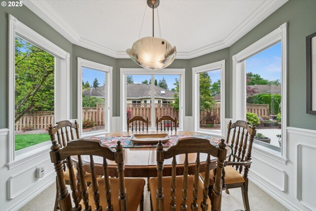 2678 SE Myrtlewood Way, Gresham, OR 97080 - dining area with light colored carpet, wainscoting, healthy amount of natural light, ornamental molding, and a decorative wall