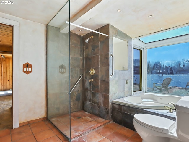 bathroom with tile patterned floors, a garden tub, toilet, and a tile shower