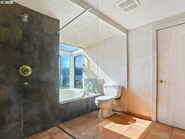 full bathroom featuring visible vents, toilet, tile patterned flooring, a relaxing tiled tub, and tiled shower