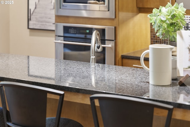 10122 SW Morrison St, Portland, OR 97225 - kitchen with stainless steel oven and a desk