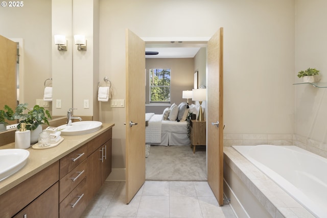 10122 SW Morrison St, Portland, OR 97225 - bathroom featuring double vanity, ensuite bathroom, a garden tub, and tile patterned floors