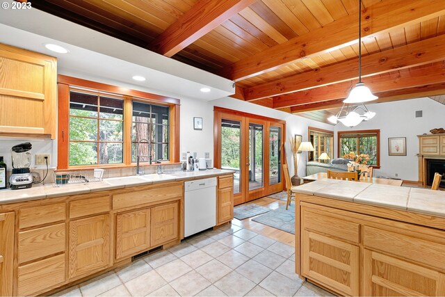 57953 Drury Ln, Blue River, OR 97413 - kitchen featuring pendant lighting, beamed ceiling, sink, white dishwasher, and light brown cabinets