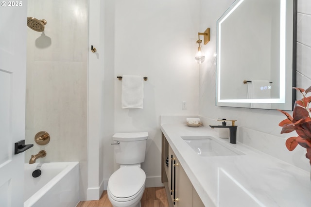 118 W 13th Way, La Center, WA 98629 - bathroom featuring vanity, toilet, wood finished floors, bathtub / shower combination, and baseboards