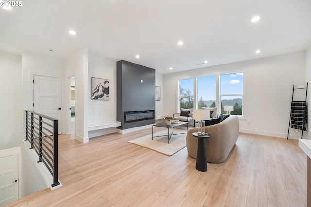 118 W 13th Way, La Center, WA 98629 - living room with light wood-style floors, recessed lighting, and baseboards