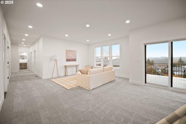 118 W 13th Way, La Center, WA 98629 - living room featuring light carpet, baseboards, and recessed lighting