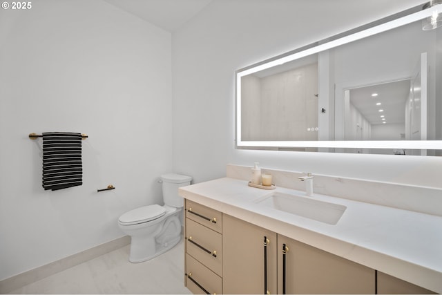 118 W 13th Way, La Center, WA 98629 - bathroom with vanity, toilet, marble finish flooring, and baseboards