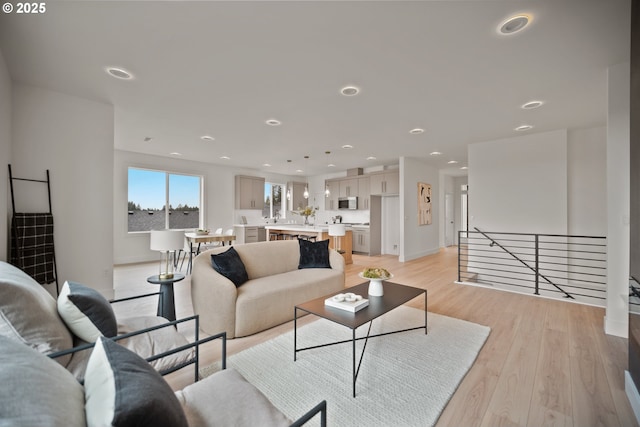 118 W 13th Way, La Center, WA 98629 - living room featuring light wood finished floors, recessed lighting, and baseboards