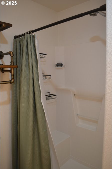 full bath with a shower with shower curtain