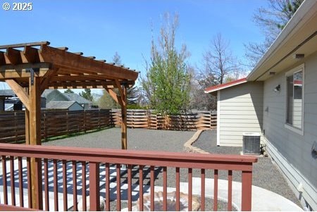 wooden terrace featuring a fenced backyard, a pergola, and central AC unit