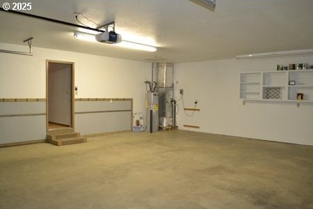 garage with a garage door opener and water heater