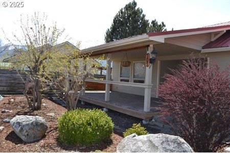 view of side of home with a deck