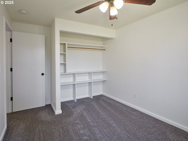 503 E Yacolt Rd, Yacolt, WA 98675 - unfurnished bedroom featuring dark colored carpet, a ceiling fan, and a closet