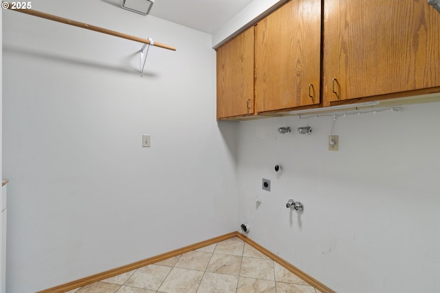 washroom with gas dryer hookup, hookup for a washing machine, hookup for an electric dryer, baseboards, and cabinet space