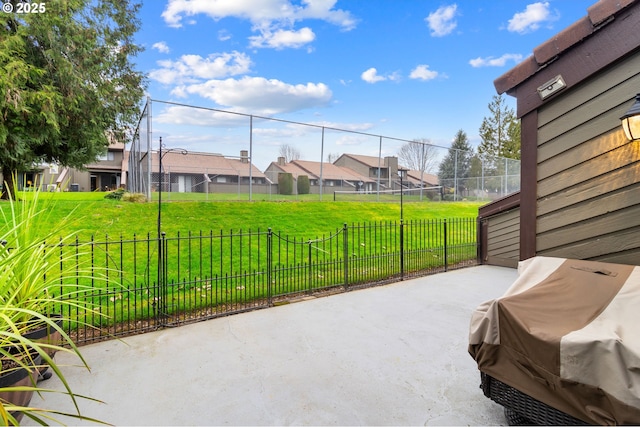 view of patio featuring a residential view, fence, and area for grilling