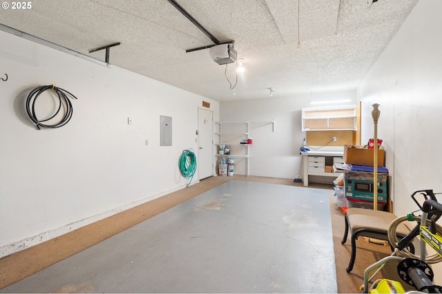 garage with electric panel and a garage door opener