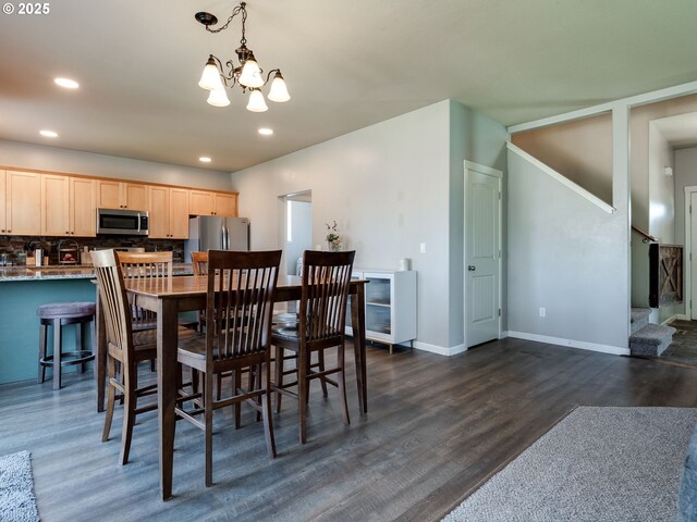 dining space featuring a chandelier, dark wood-style floors, recessed lighting, stairway, and baseboards