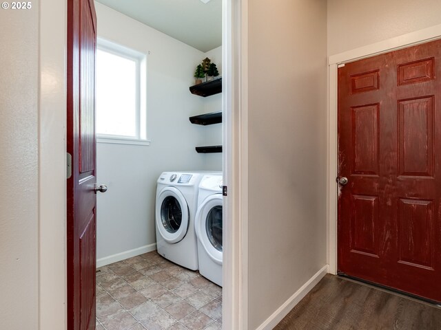laundry area featuring independent washer and dryer and baseboards
