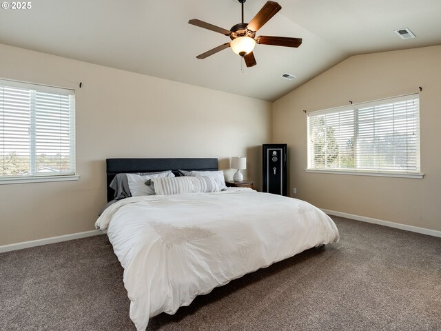 carpeted bedroom featuring multiple windows, lofted ceiling, baseboards, and a ceiling fan