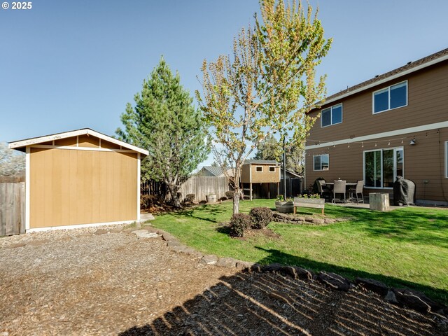 view of yard with an outdoor structure and a patio