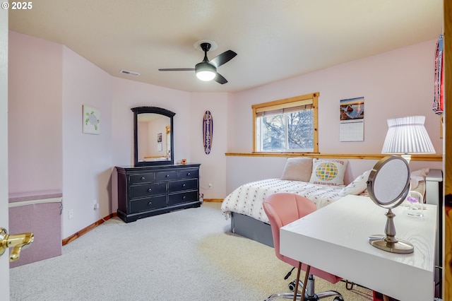 carpeted bedroom featuring visible vents, a ceiling fan, and baseboards