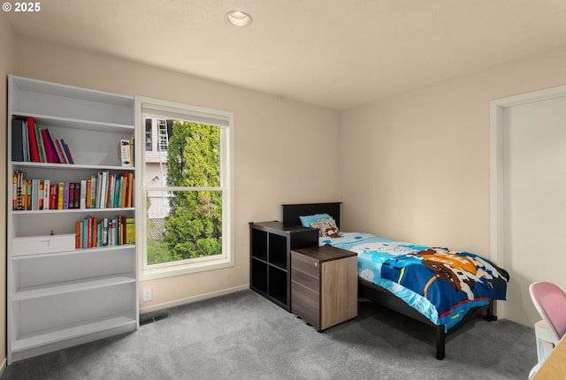 bedroom featuring carpet flooring, visible vents, and baseboards