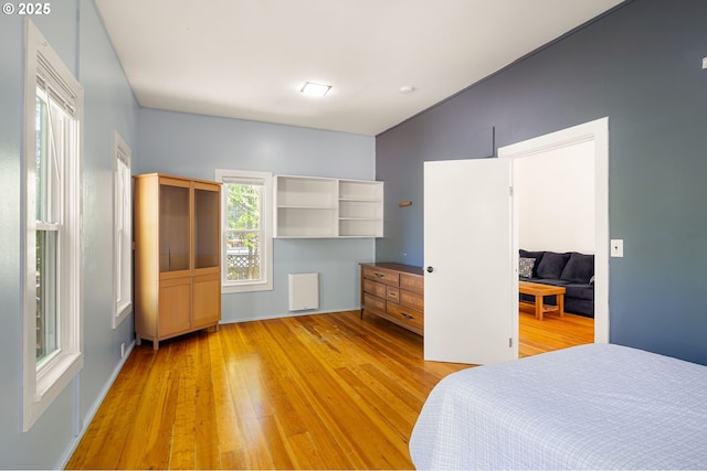 1963 Villard St, Eugene, OR 97403 - bedroom with light wood-style flooring, lofted ceiling, and radiator heating unit