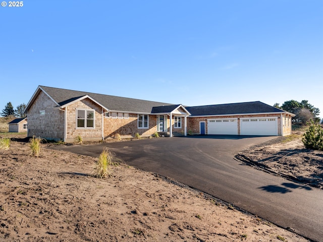 ranch-style house featuring a garage