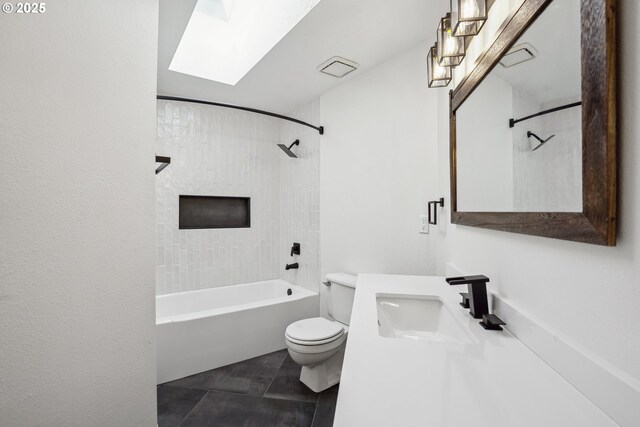bathroom featuring  shower combination, toilet, vanity, and a skylight
