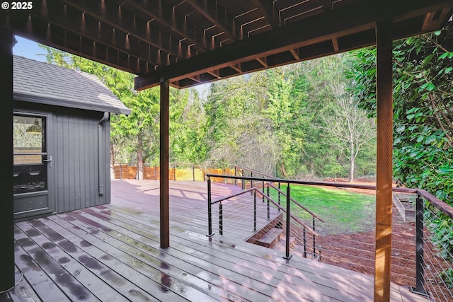 wooden deck featuring a forest view