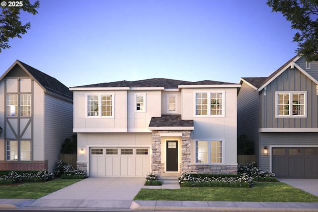 view of front of house featuring a garage, concrete driveway, and stucco siding