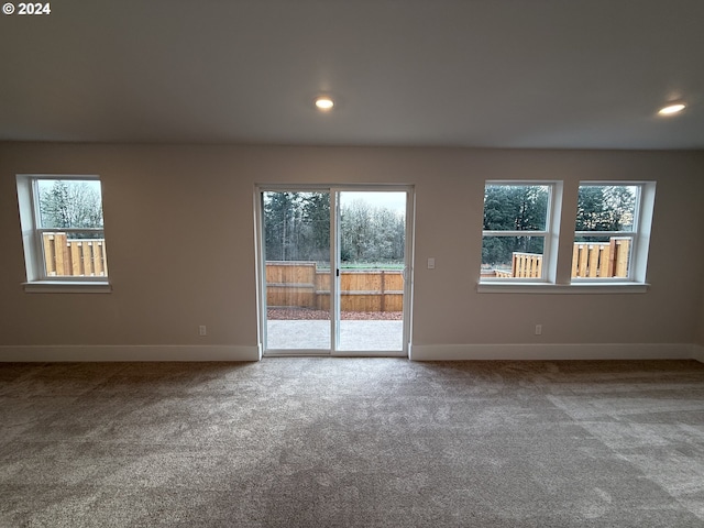 empty room with recessed lighting, carpet flooring, and baseboards