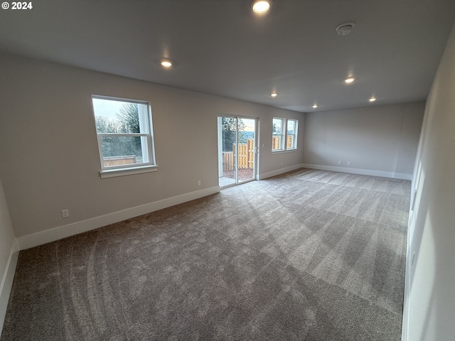 spare room with baseboards, carpet, and recessed lighting