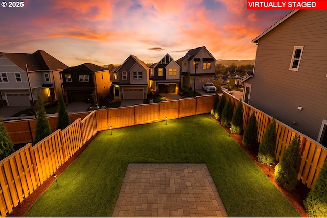 17940 SW Alvord Ln, Beaverton, OR 97007 - yard at dusk featuring a residential view and a fenced backyard