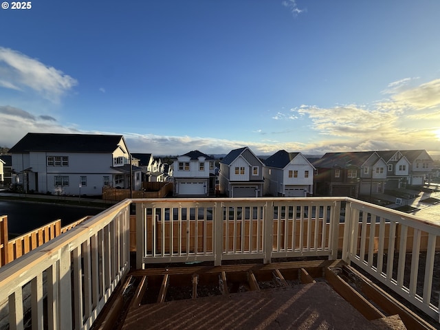 wooden deck featuring a residential view