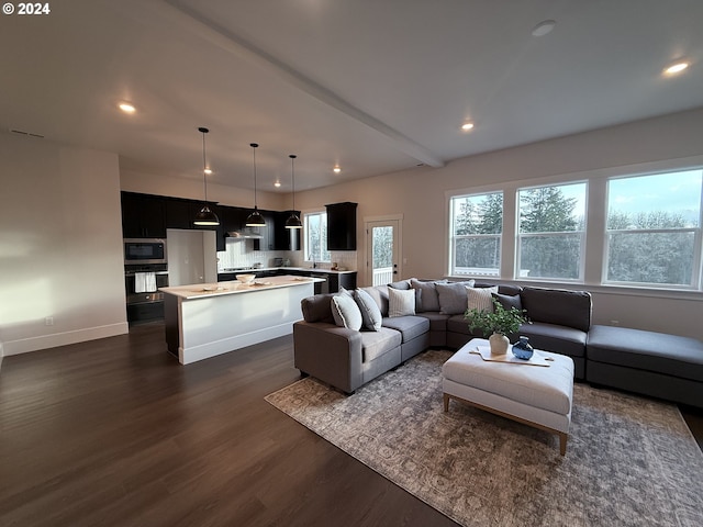 living room with dark wood-style floors, recessed lighting, beam ceiling, and baseboards