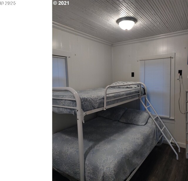 317 N Beacon St, Rockaway Beach, OR 97136 - bedroom featuring dark hardwood / wood-style flooring, crown molding, and wood ceiling