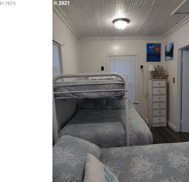 317 N Beacon St, Rockaway Beach, OR 97136 - bedroom featuring crown molding and wood-type flooring