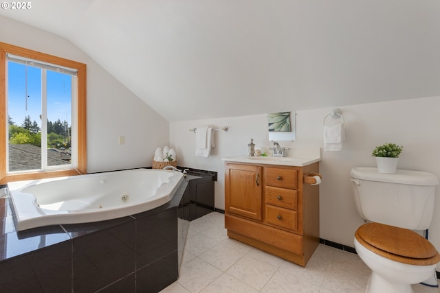 full bathroom featuring vaulted ceiling, toilet, a jetted tub, vanity, and baseboards