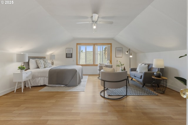 bedroom with light wood-style flooring, lofted ceiling, baseboards, and a ceiling fan